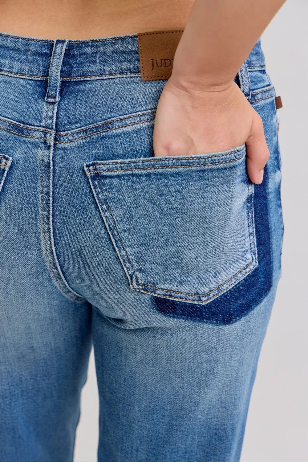 Judy Blue medium wash boyfriend jeans angled view
