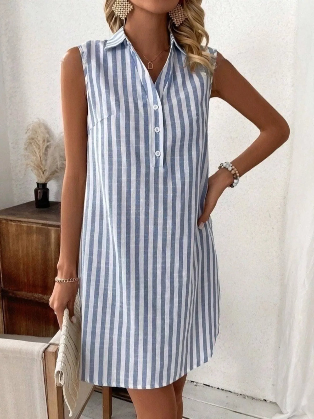 Blue striped sleeveless button front shirt dress front view