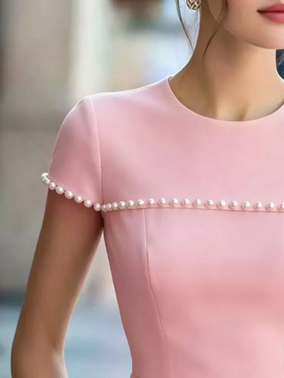 Peplum tee styled with slim trousers