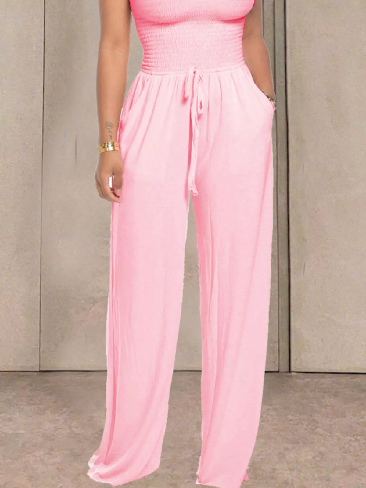 Sky blue strapless smocked wide leg jumpsuit front view