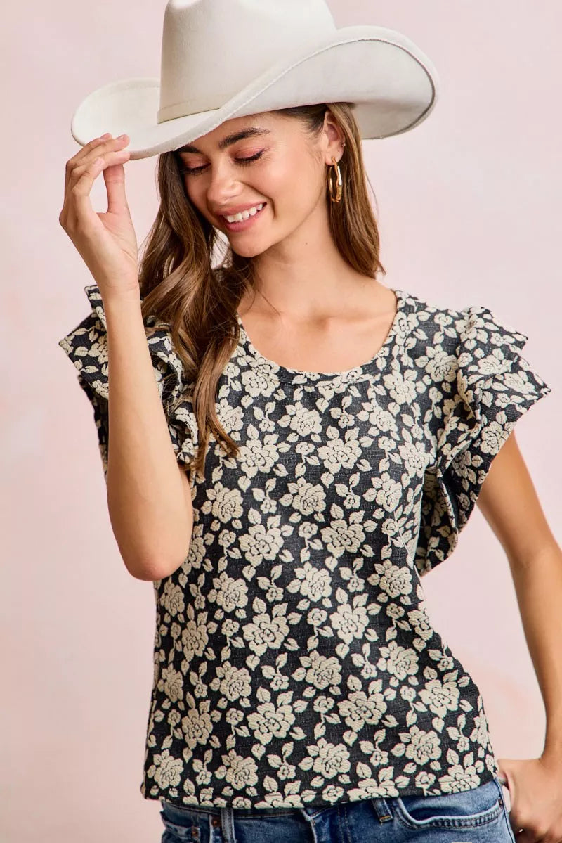 Black and light grey floral jacquard ruffle top front view