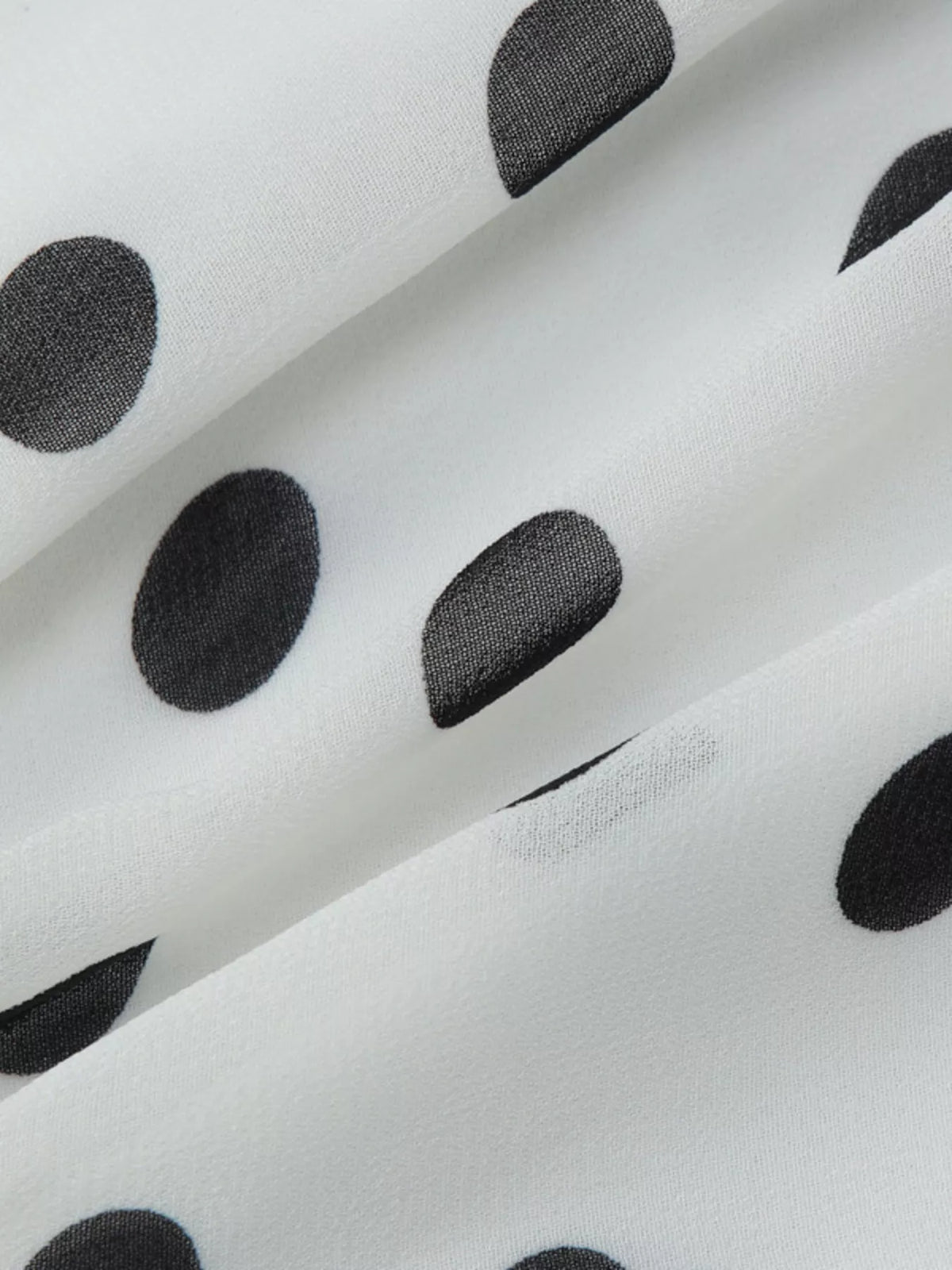 Bodice detail of the polka dot halter neck dress