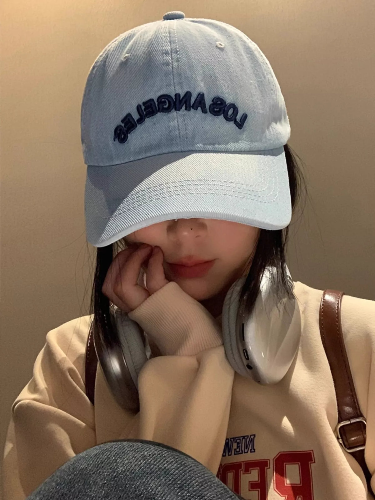 Embroidery detail on denim look cotton cap