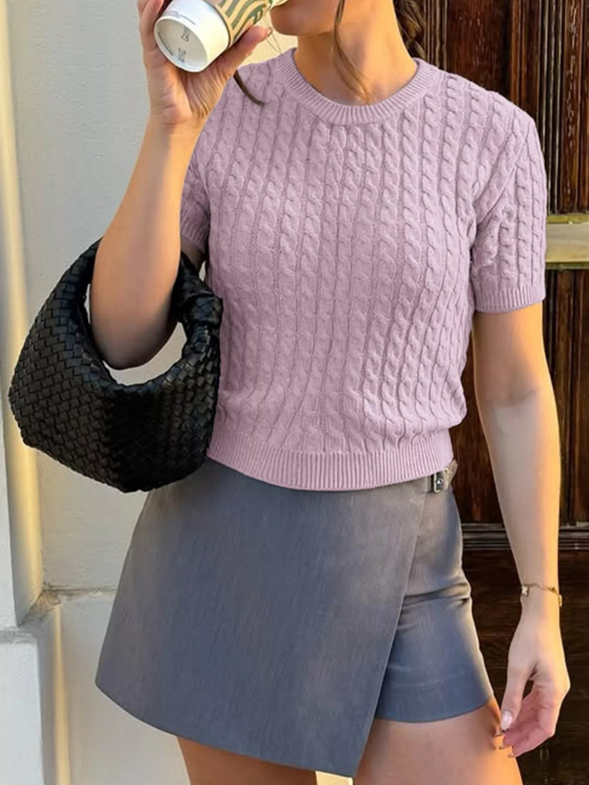 cable knit short sleeve sweater seated styling view