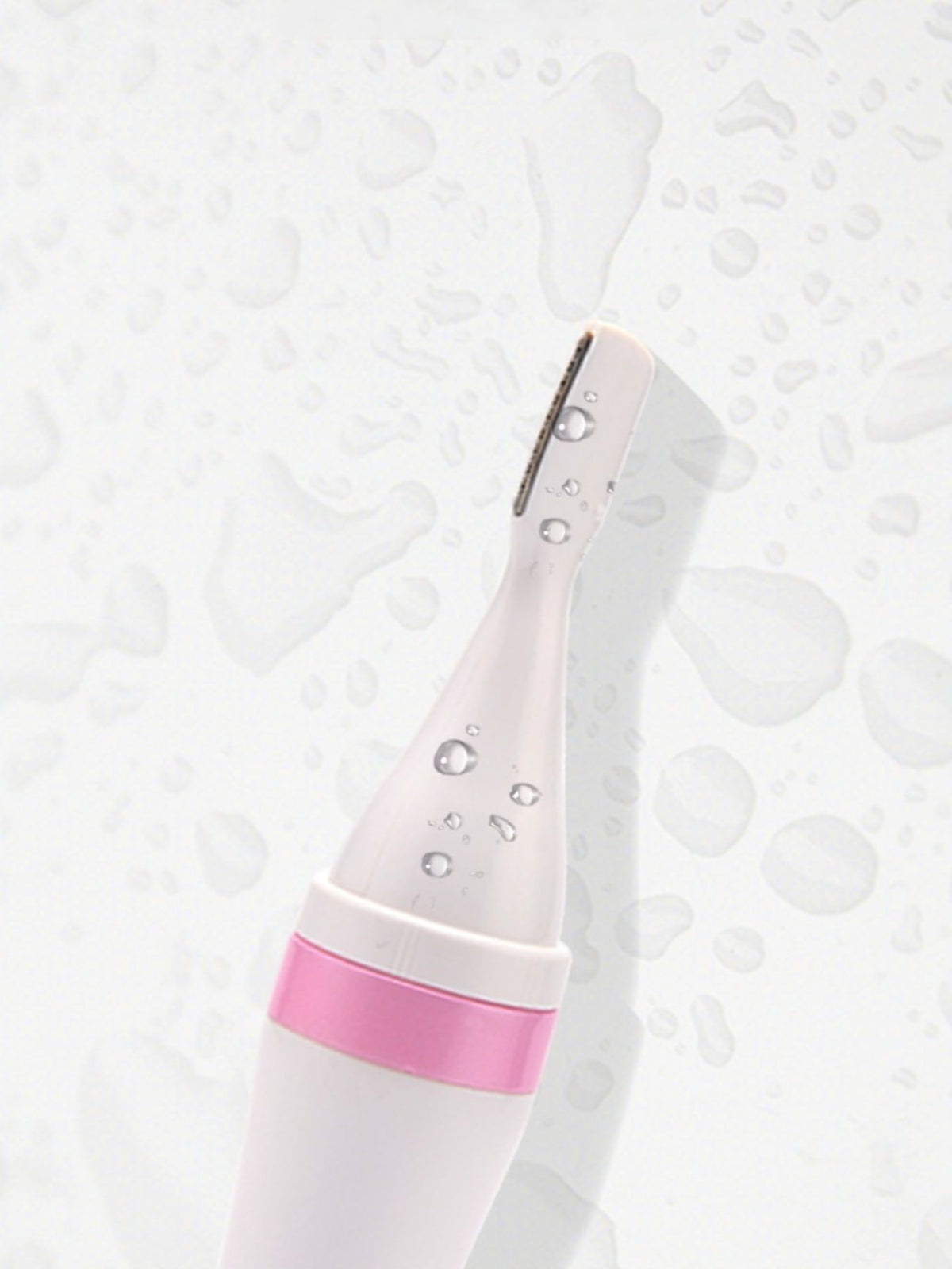 Nose hair trimmer held in hand