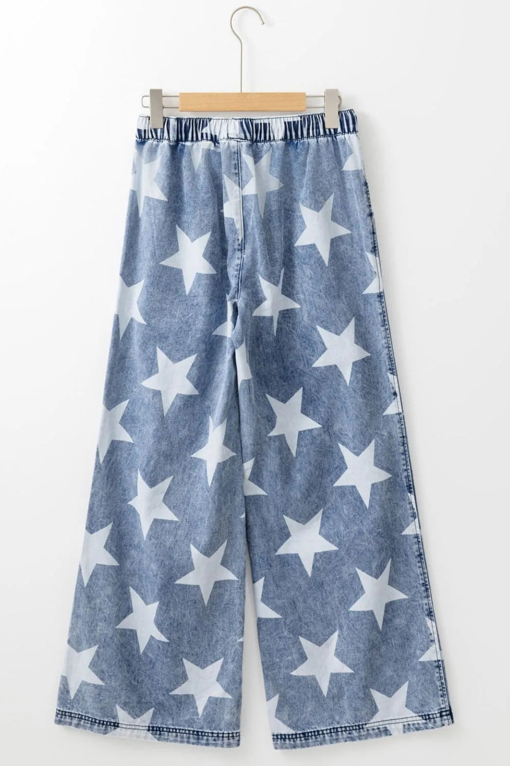 Close up of star print pattern on washed denim