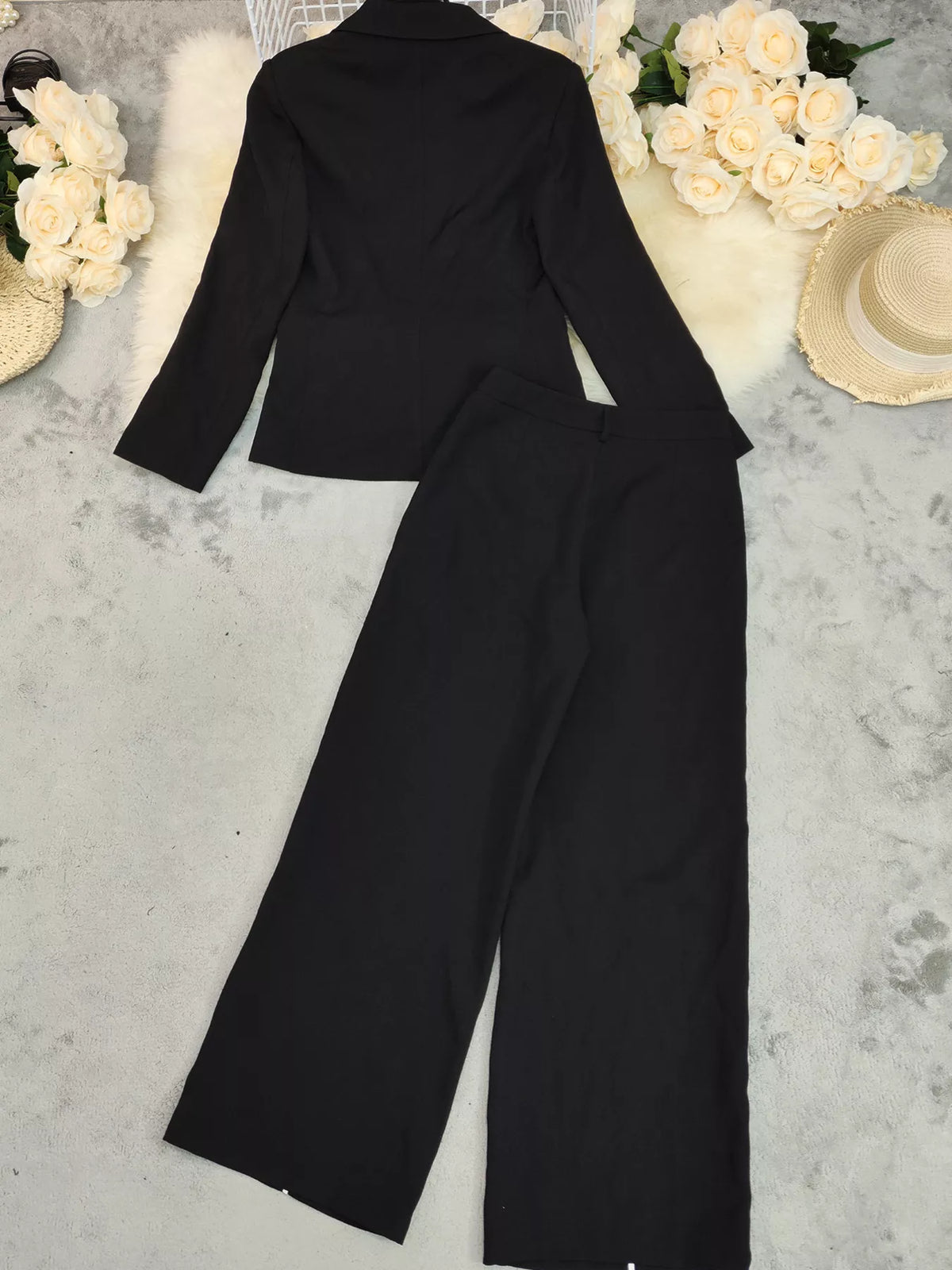 Black matching blazer and wide leg pants set detail