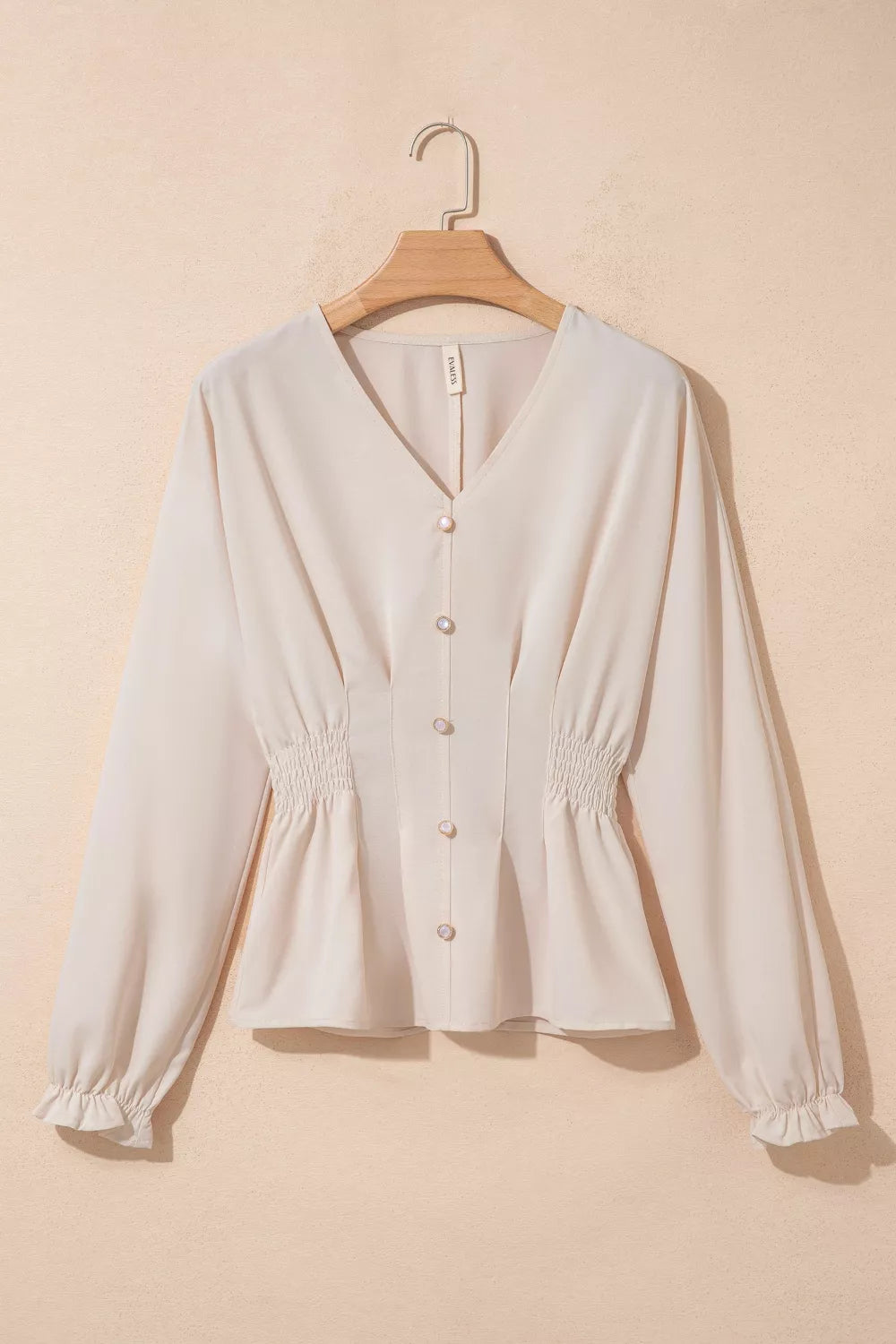 Ruched detail through the body of the polyester blouse