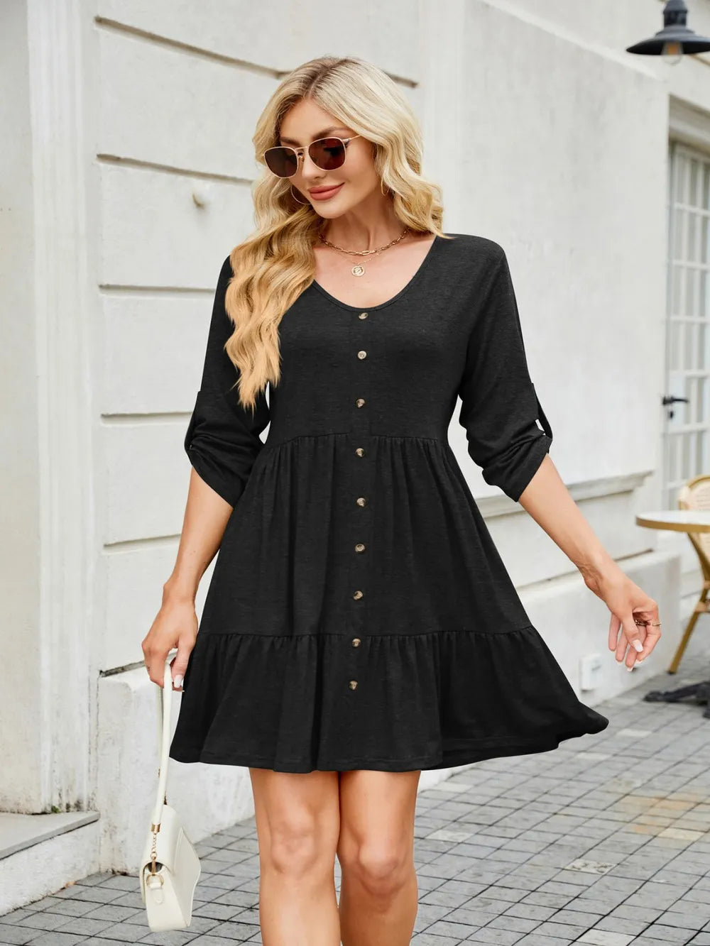 Back view of tiered ruched mini dress