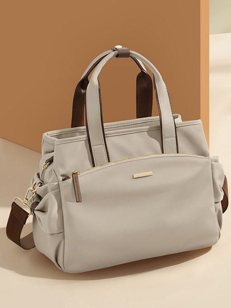 Light gray nylon top handle shoulder bag front view