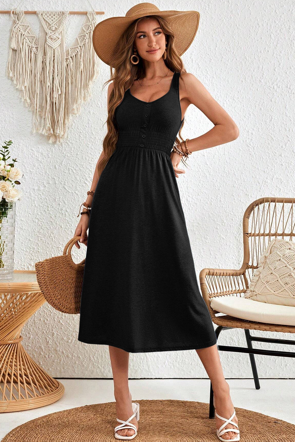 Black sleeveless midi dress with button details close up