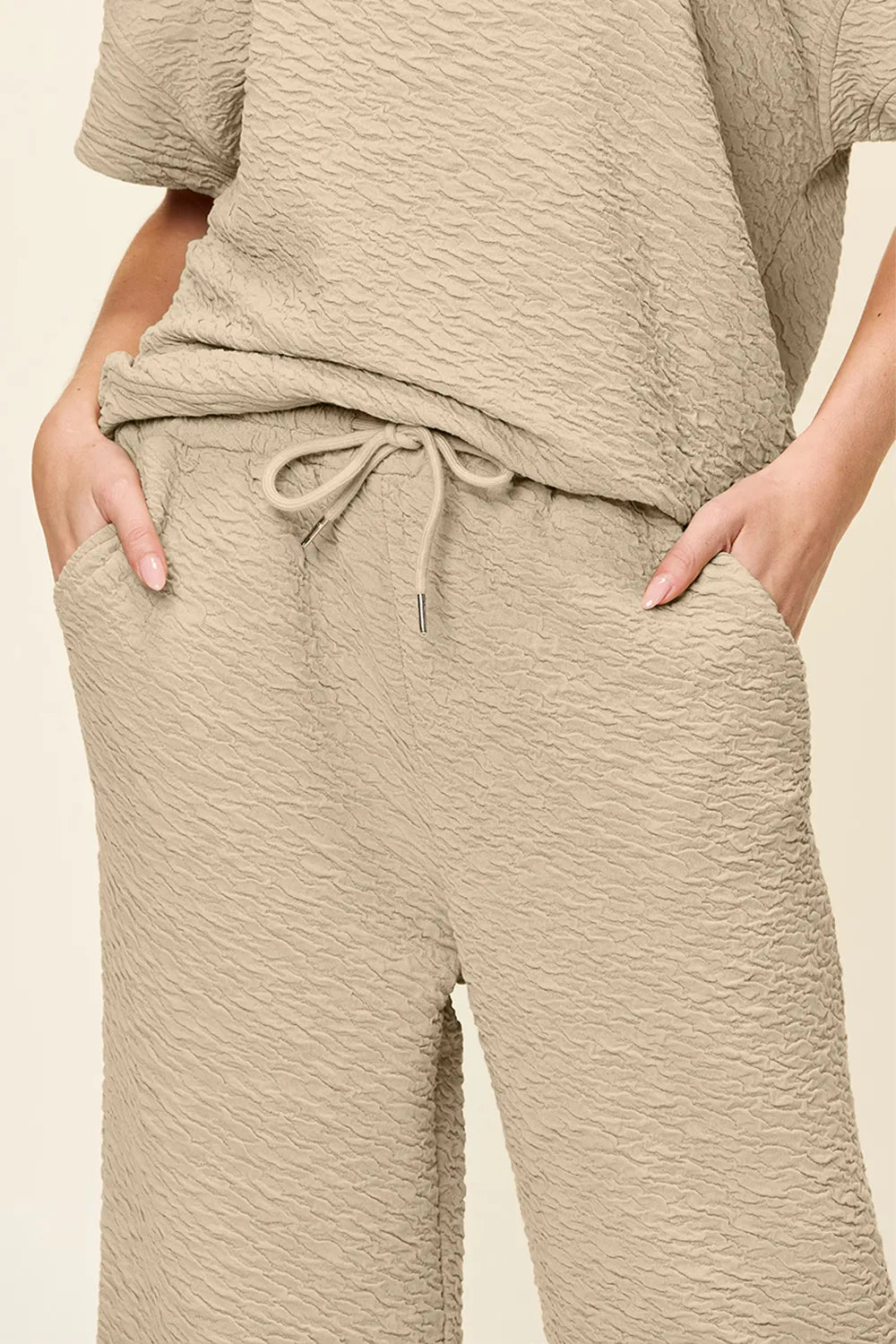 Close up of textured knit fabric on womens two piece set