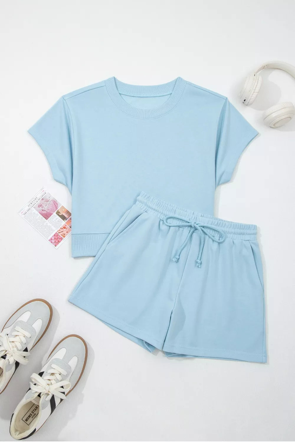 Matching pastel blue drawstring shorts close up