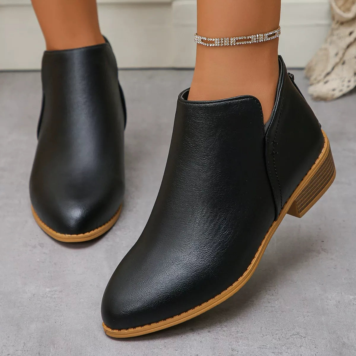 Point toe low heel boots back heel view