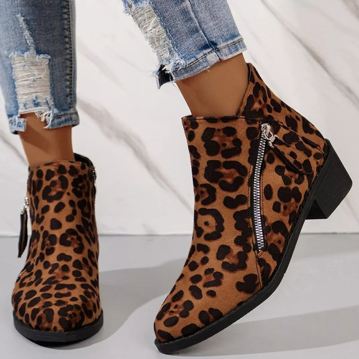 Leopard point toe block heels boots close up of the toe
