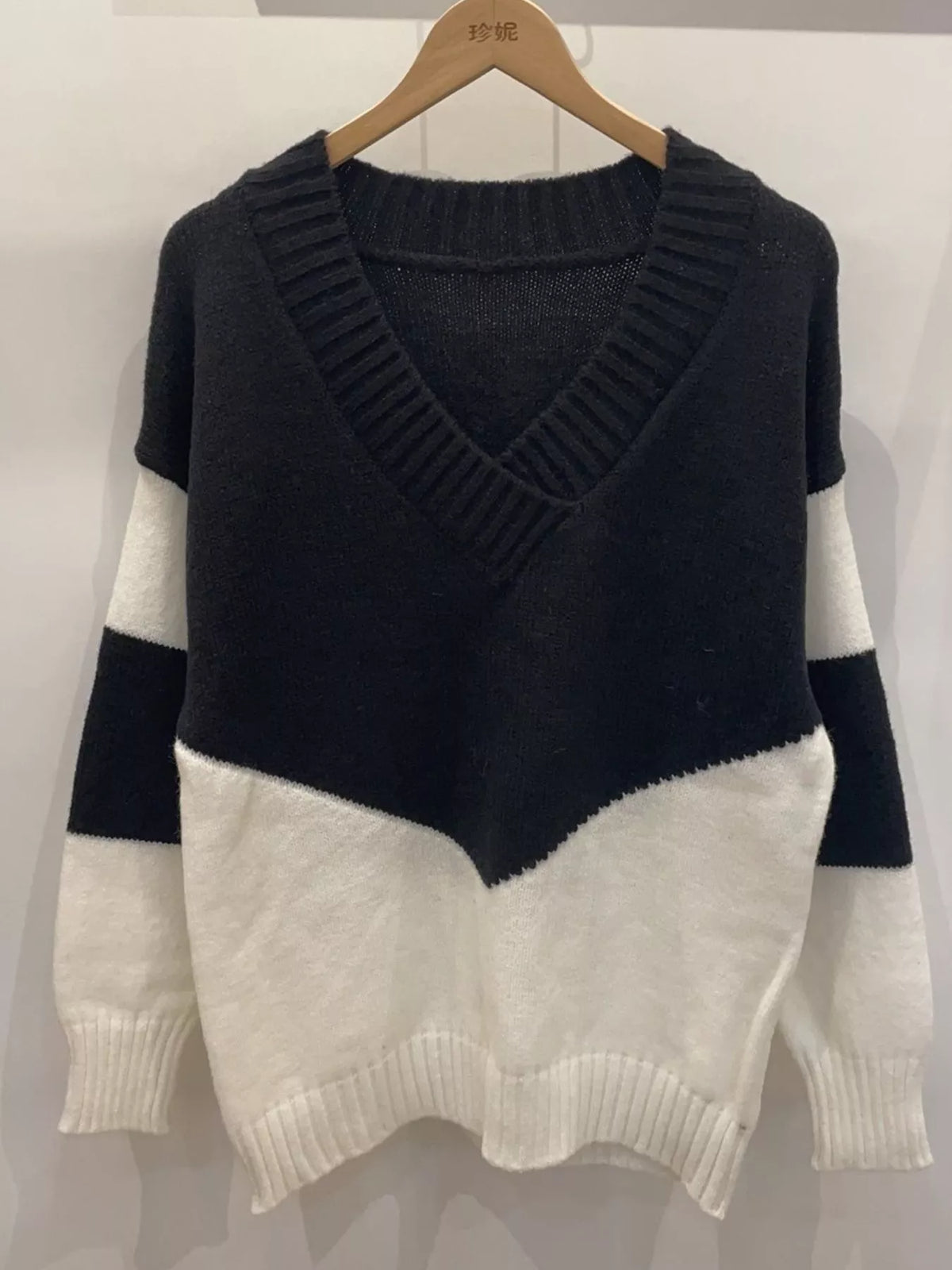 color block v neck knit sweater seated styling view