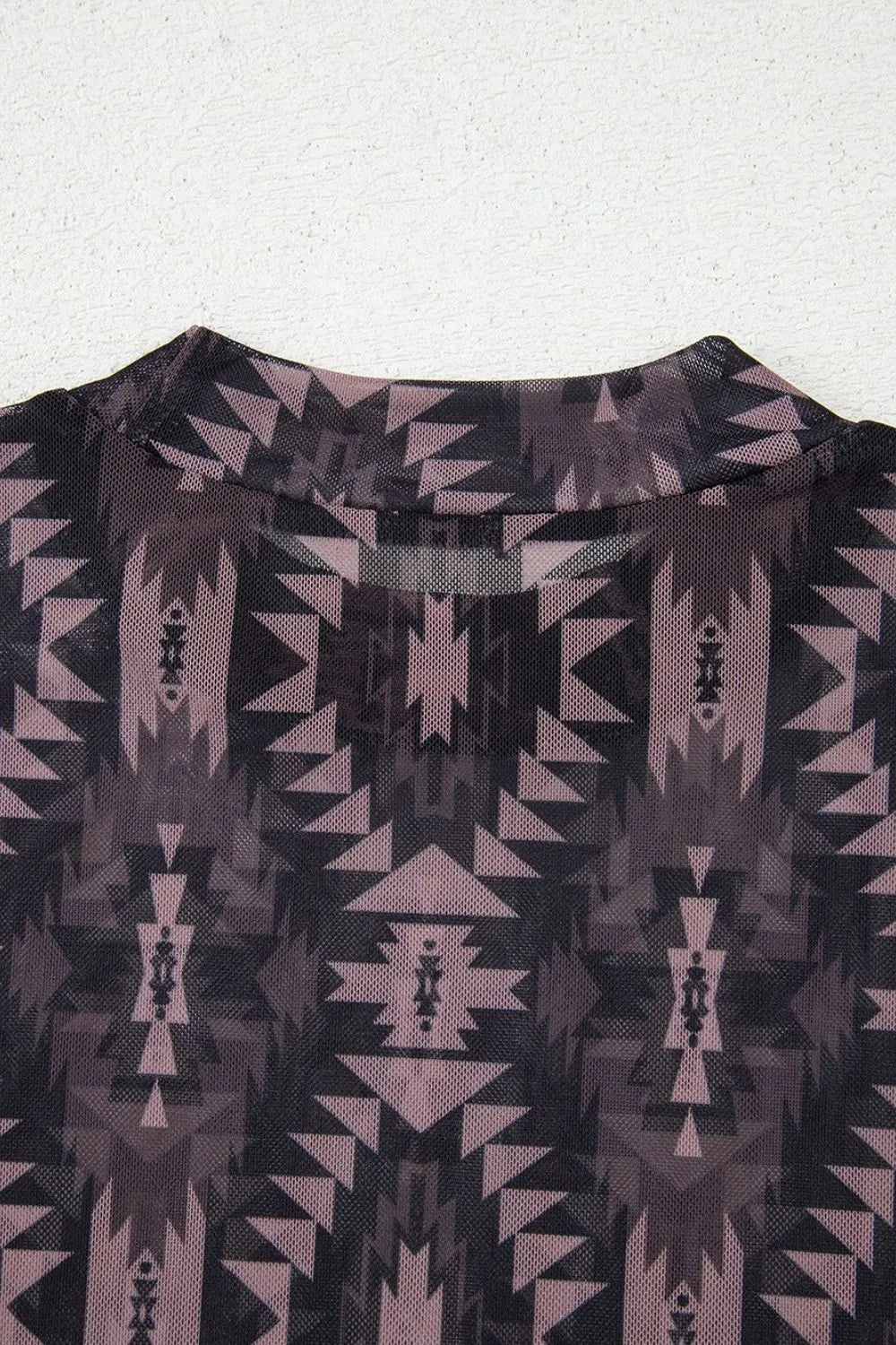Geometric print mesh top layered under a blazer