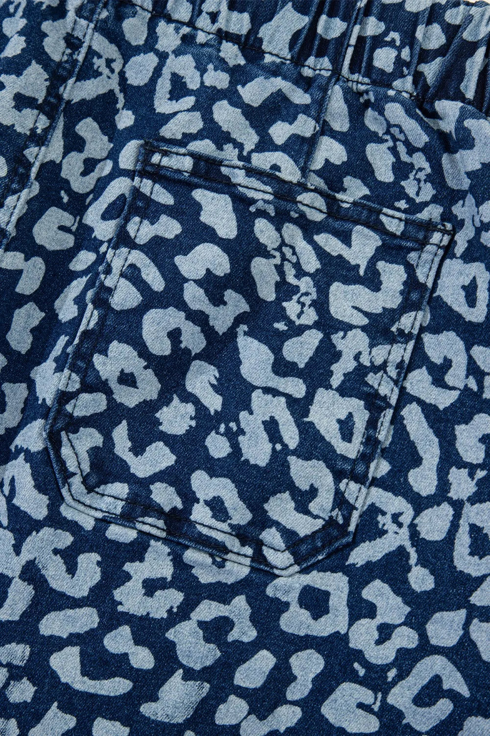 Wide leg drape on printed denim