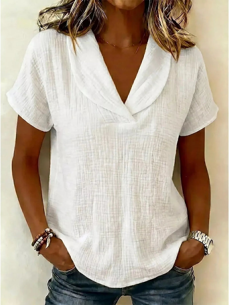 Textured short sleeve blouse front view on model