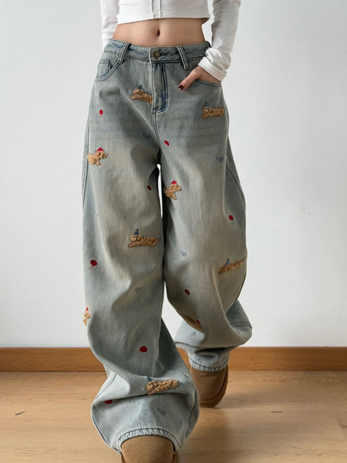 Back view of embroidered wide leg jeans