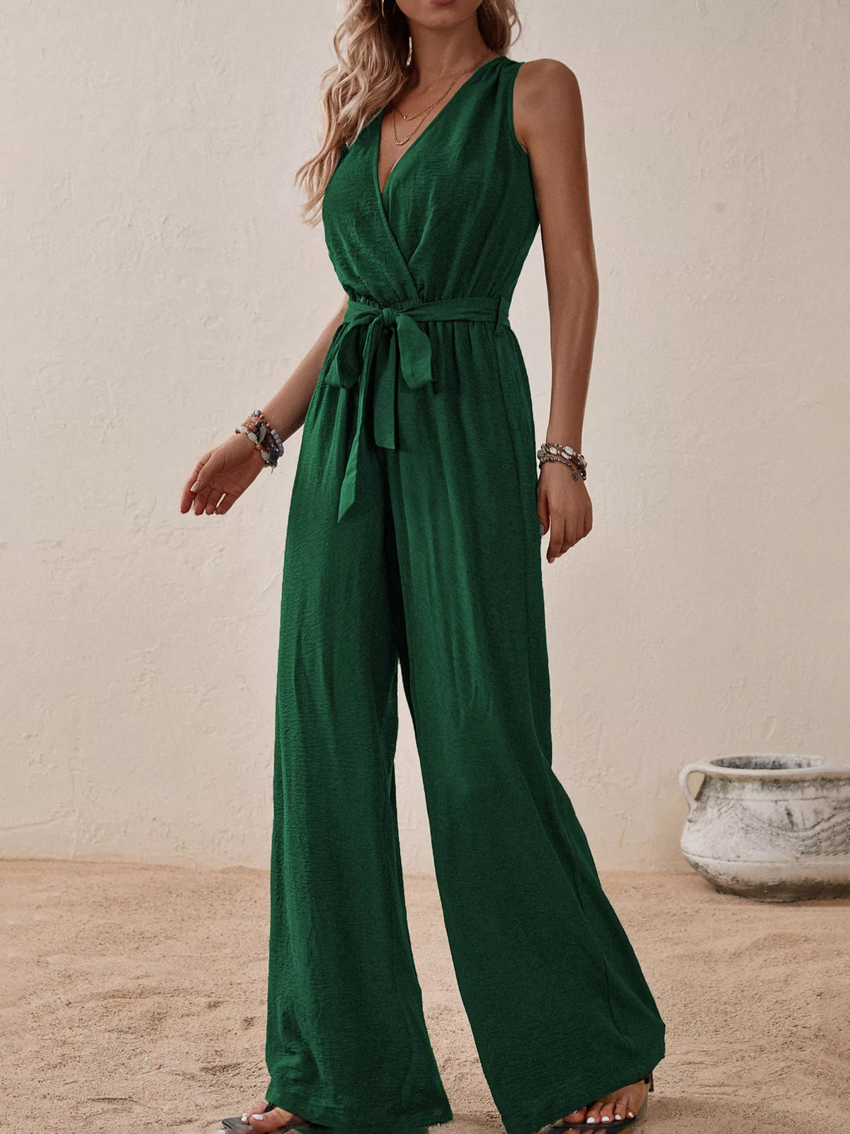 Sleeveless tie waist wide leg jumpsuit close up view