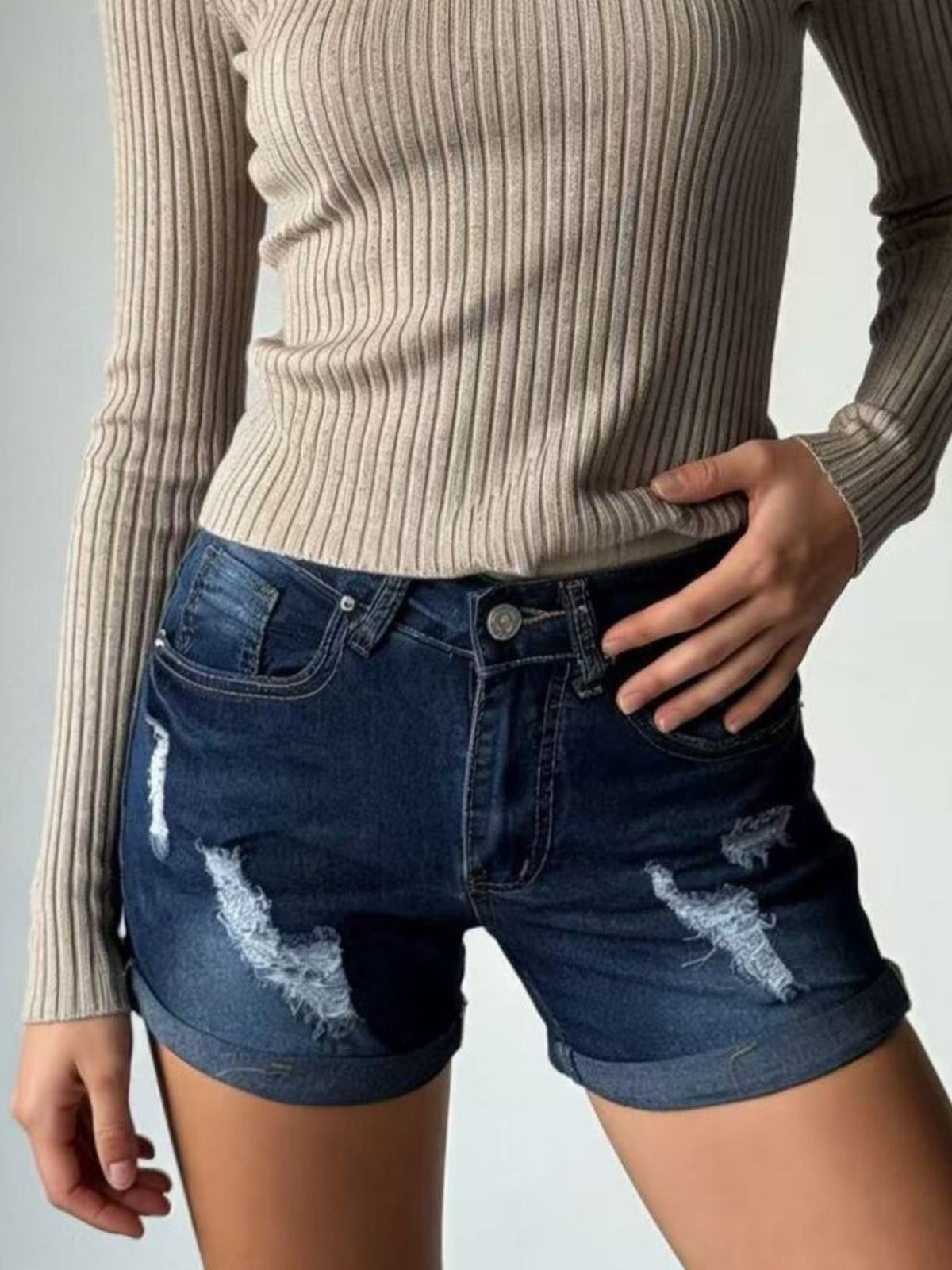 Back view of denim shorts with pockets