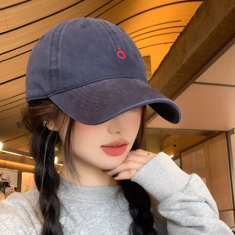 Embroidered cotton baseball cap in indigo, front view
