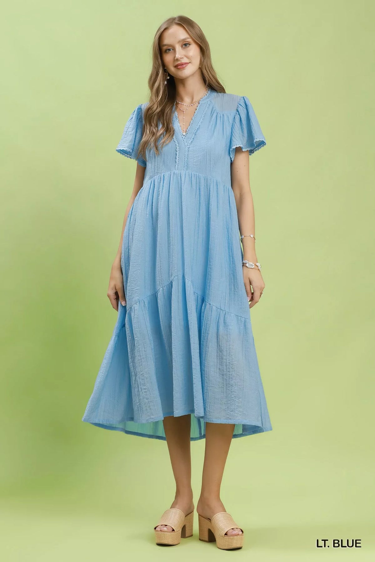 Light blue textured lace trim tiered midi dress close up view