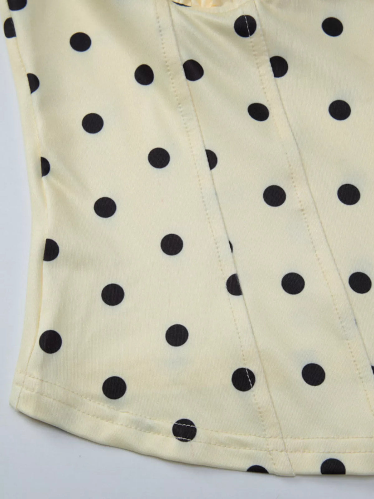 Cropped polka dot tank shown on a dress form