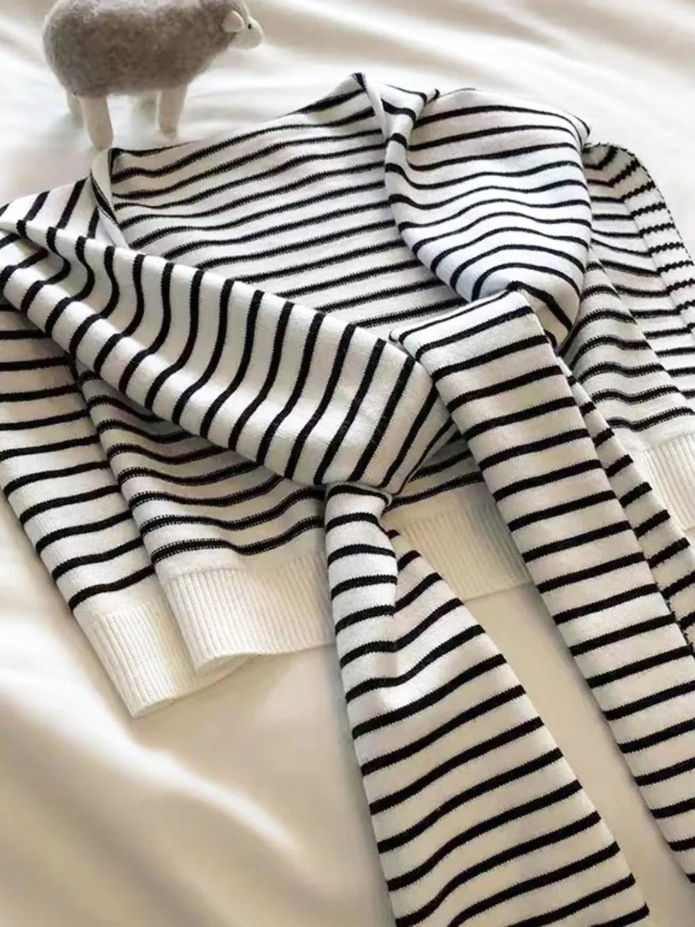 Striped contrast knit wrap styled look