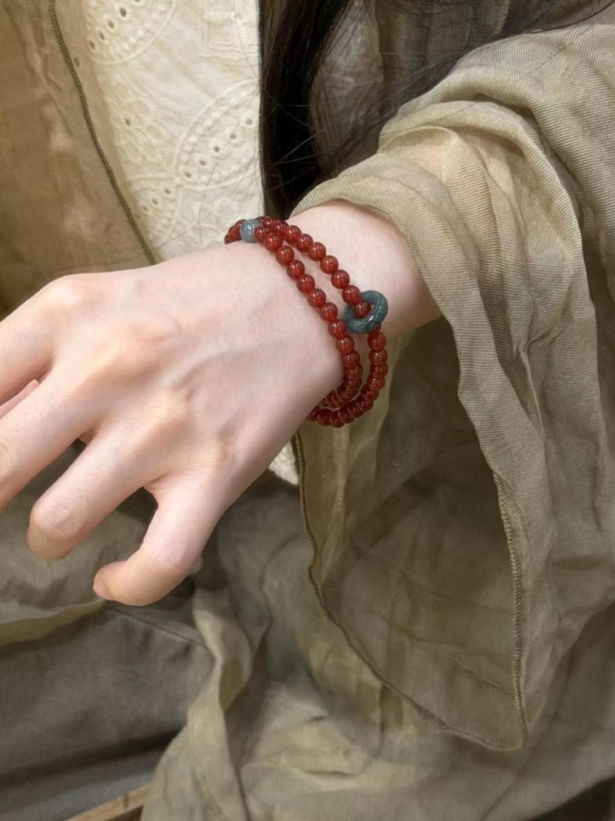 Burgundy double layered agate beaded bracelet on wrist