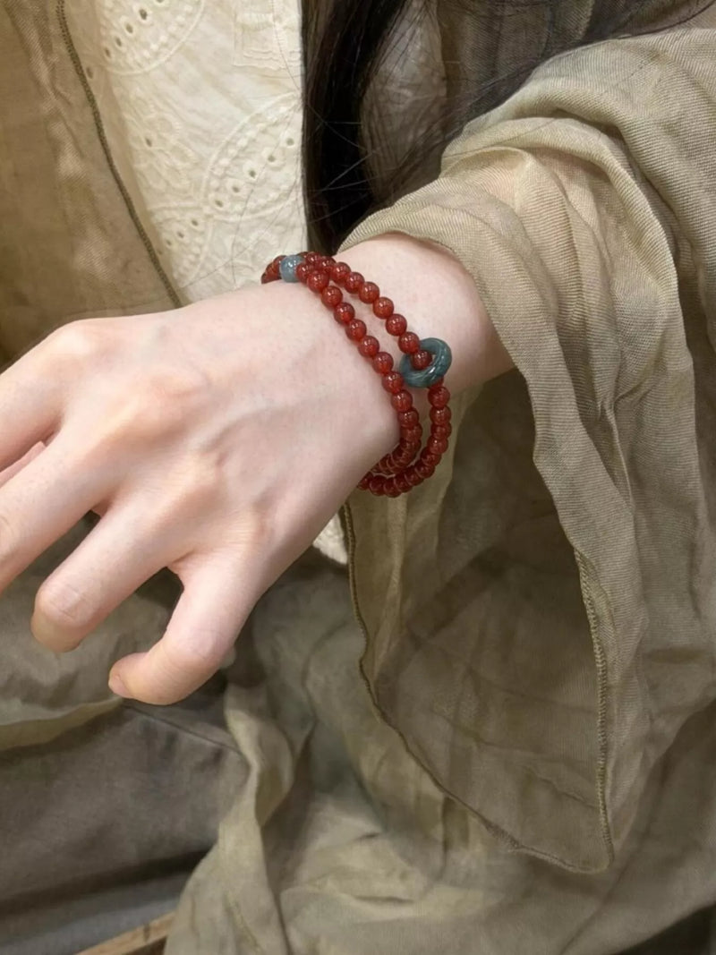 Burgundy double layered agate beaded bracelet on wrist