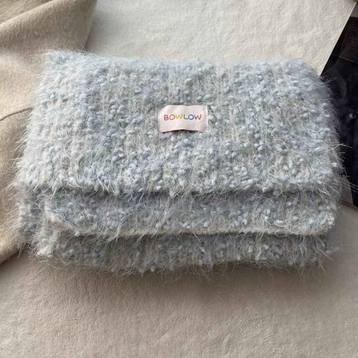 Plush scarf shown in a calm cool tone