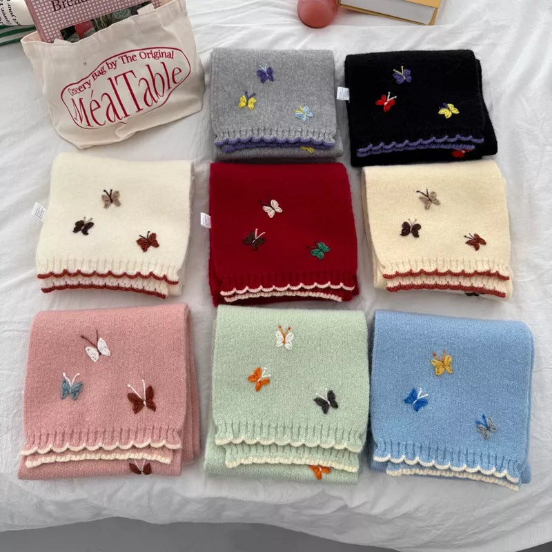 Close view of the butterfly embroidery on the knitted scarf
