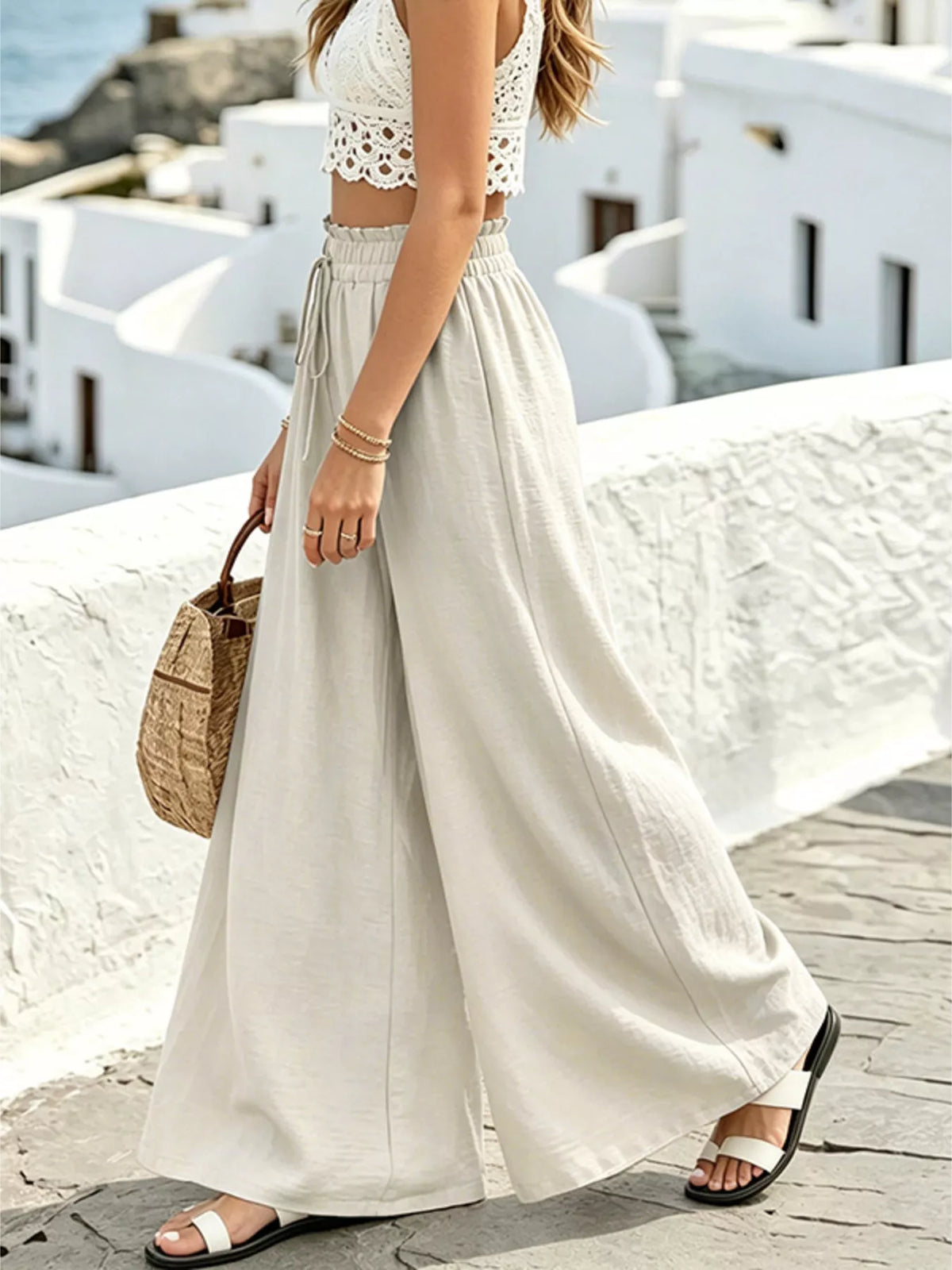 Apricot trousers showing wide leg drape