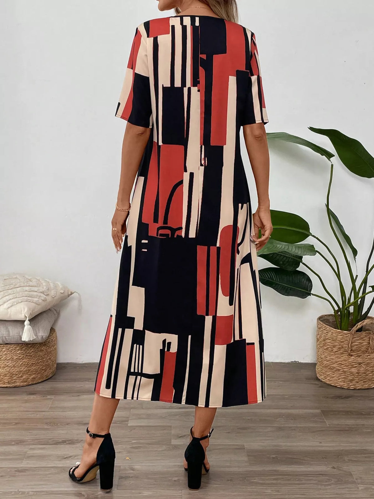 Abstract geometric print v neck midi dress back view