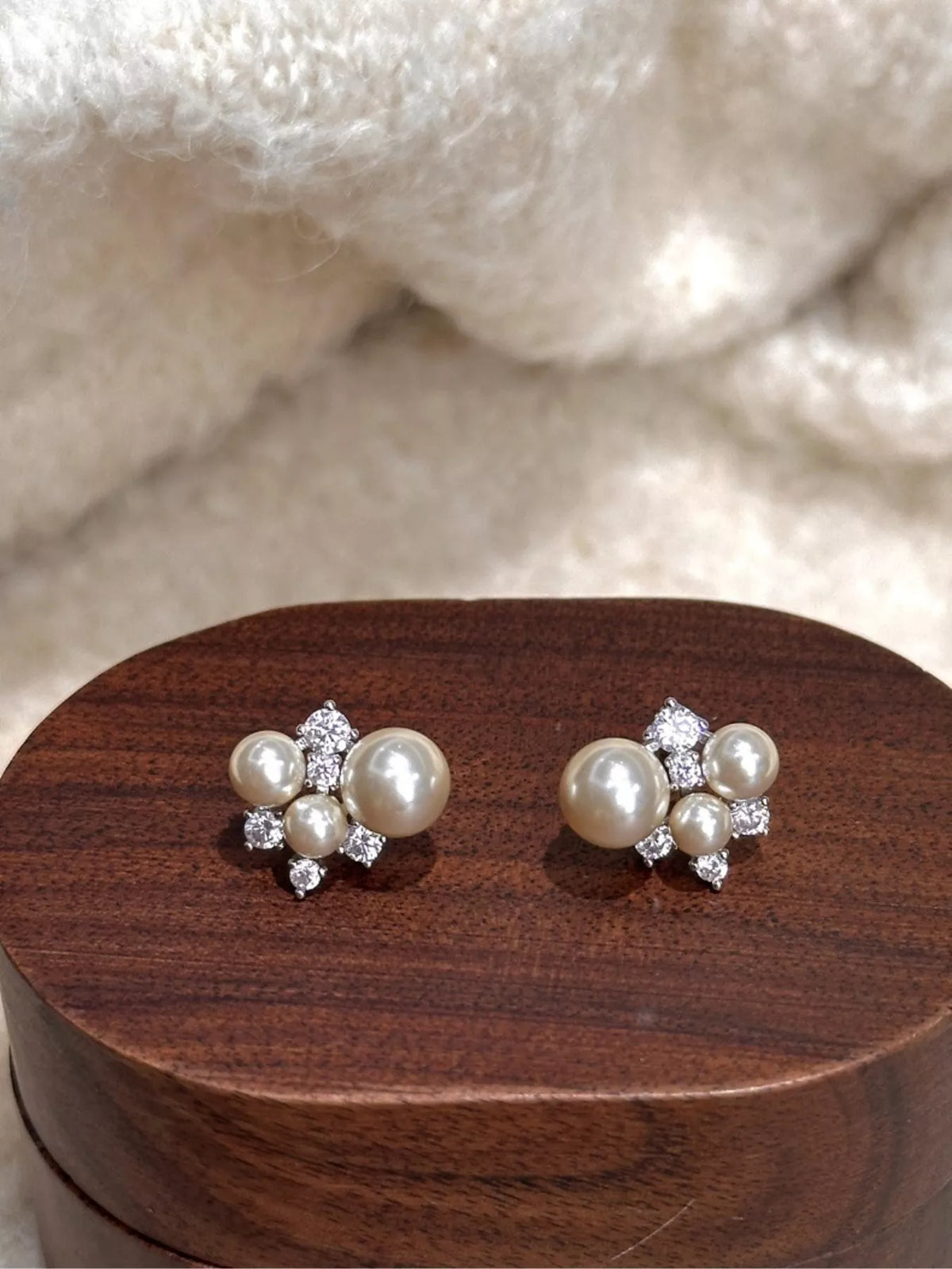 pearl cluster stud earrings styled on model