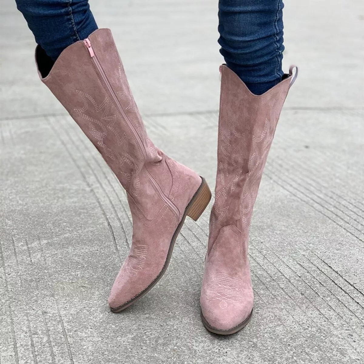 Point toe block heel suede boots texture close up