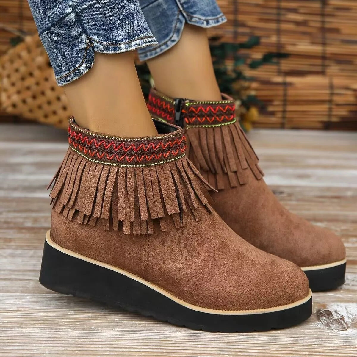 Fringe round toe ankle boots worn on model
