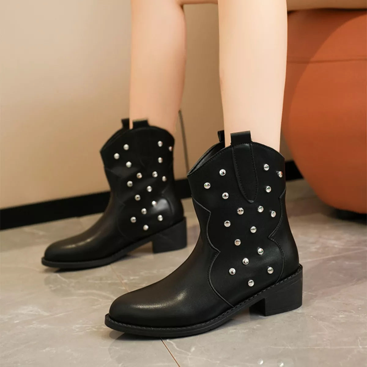 Studded western ankle boots sole view