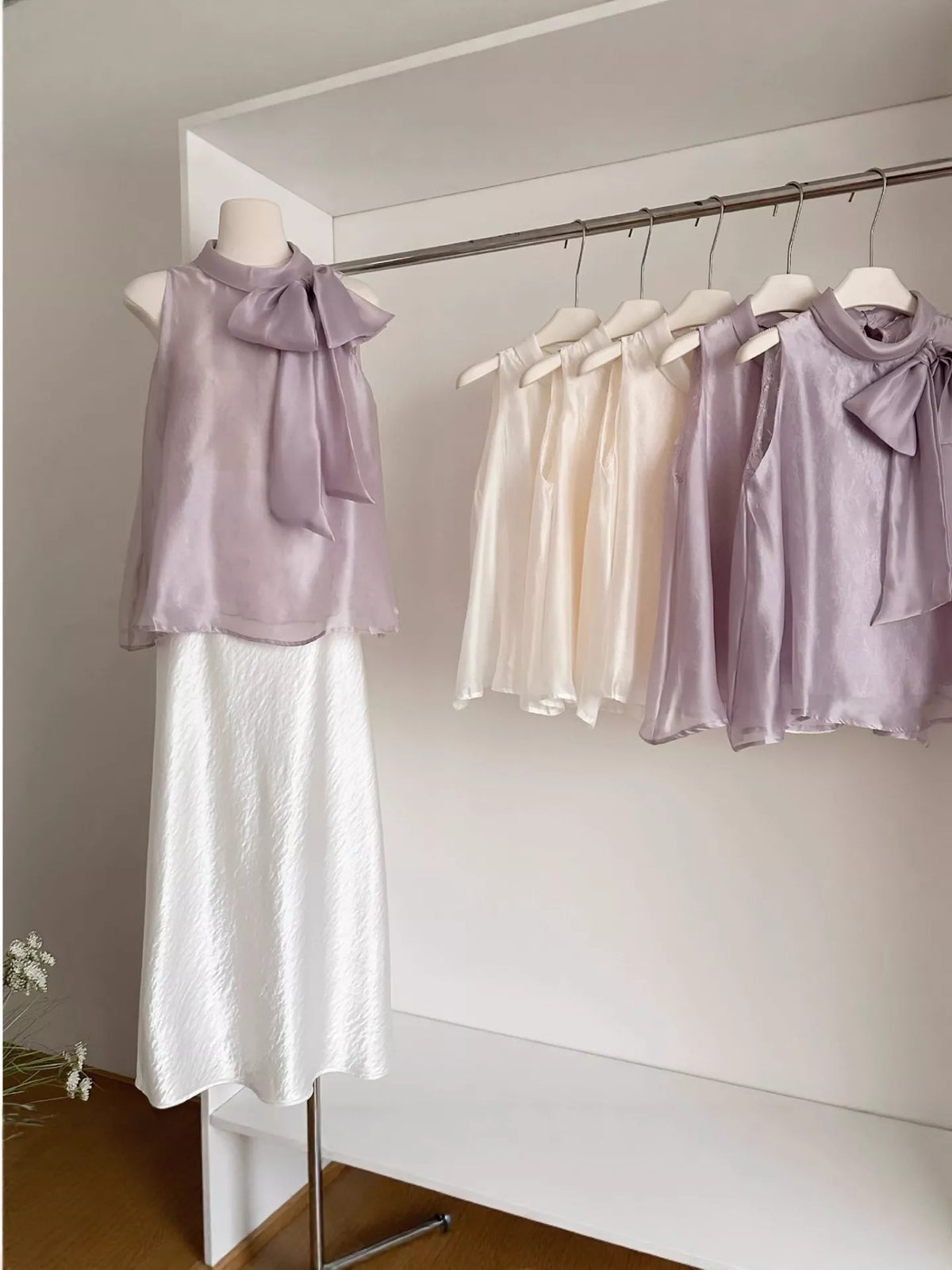 Bow chiffon sleeveless top, angled view