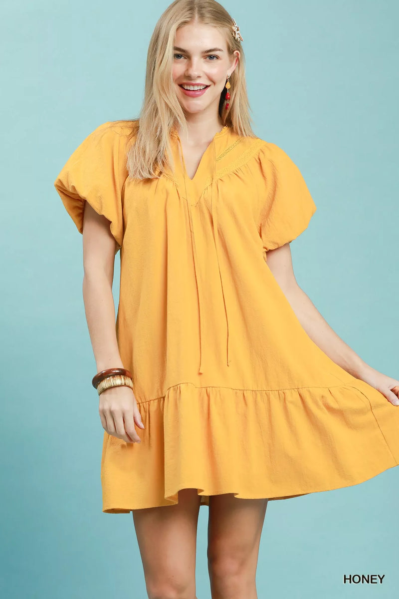 Honey flutter sleeve tassel tie ruffle hem mini dress front view