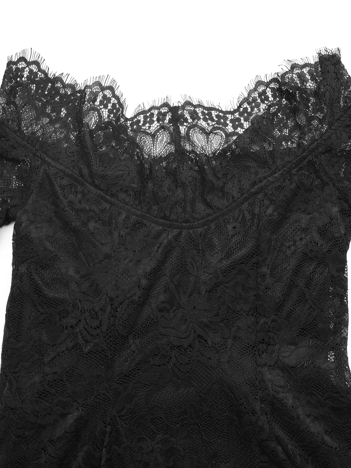 Hem detail of the black lace mini dress