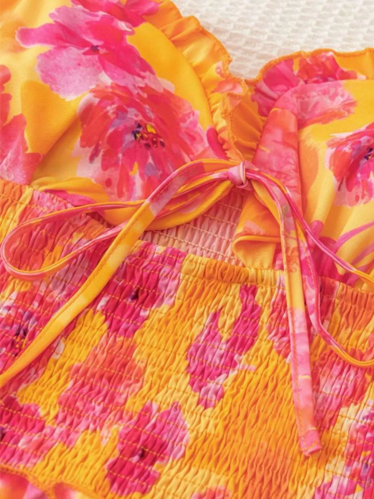 Orange floral cutout ruffle mini dress front view