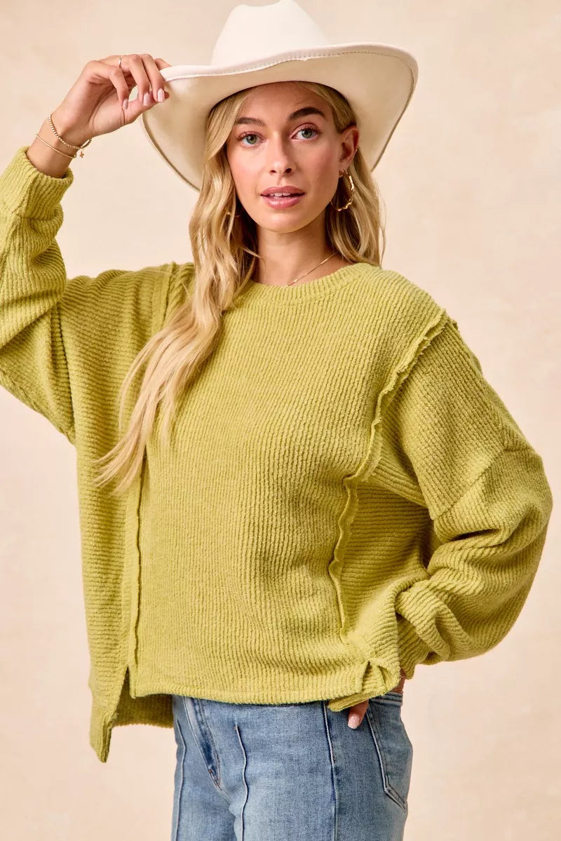 Lime green boucle knit sweater side pose