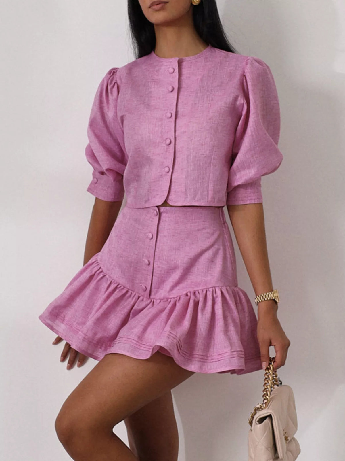 Fuchsia pink coordinated top and ruffled skirt set detail