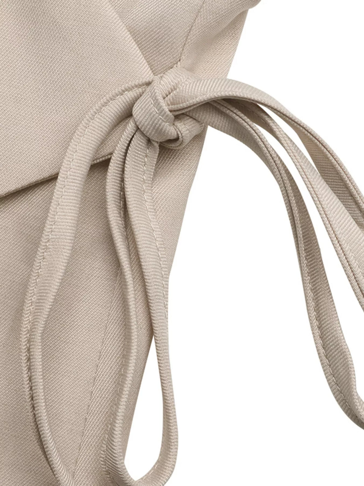Surplice wrap top tie detail close up