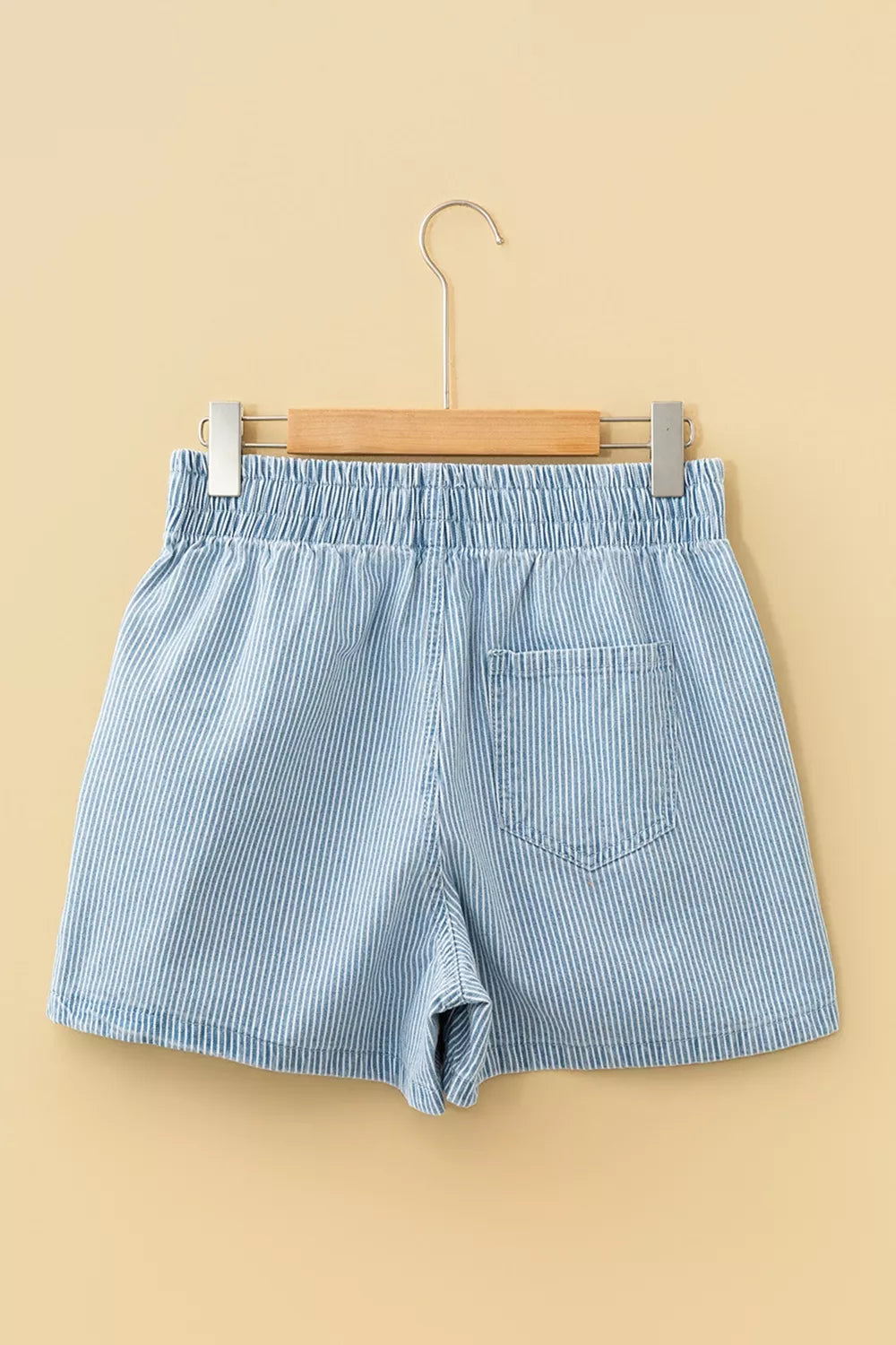 Light blue striped drawstring shorts three quarter view