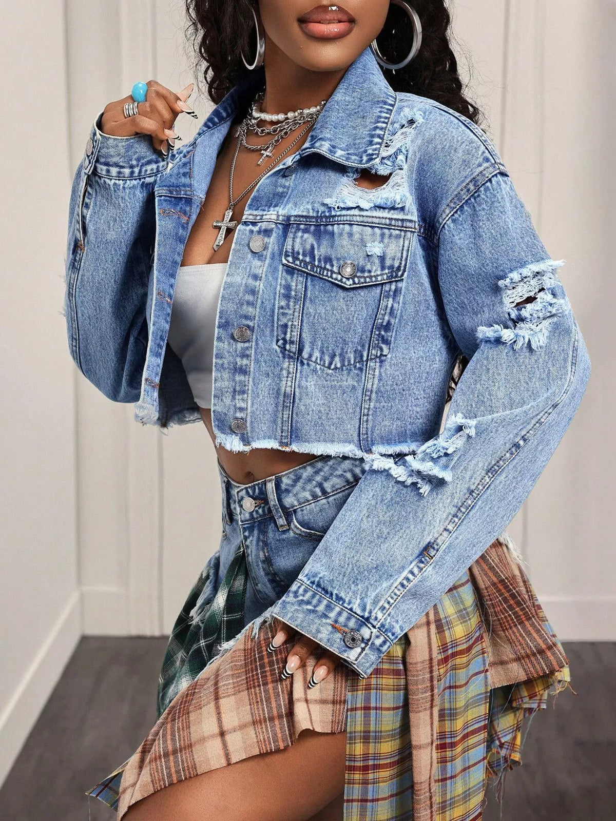 Ruffle and seam detail on a blue denim jacket