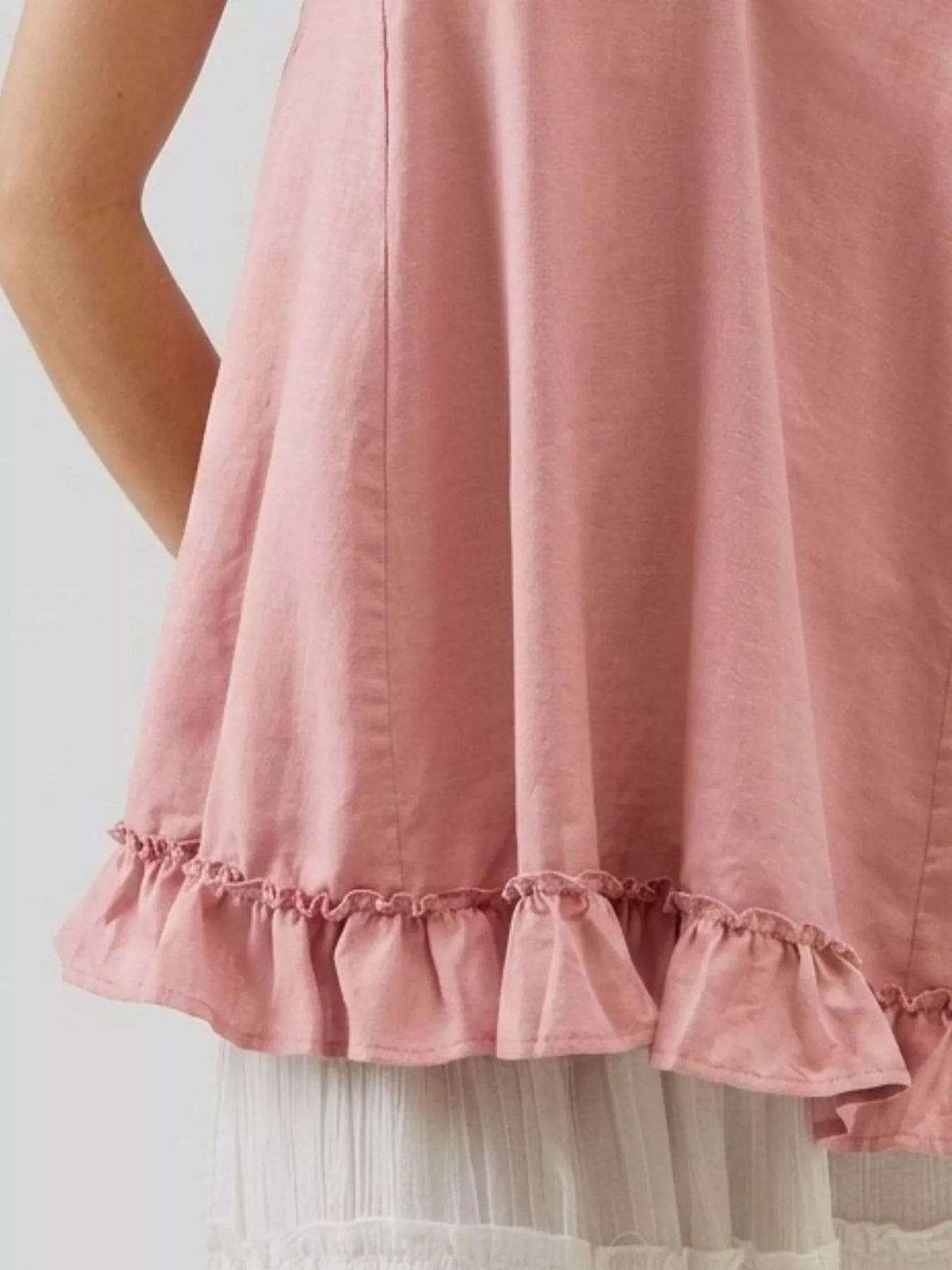Tie strap ruffle hem cami detail view